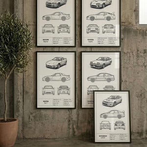 May include: Five framed wall art prints featuring technical line drawings of Japanese sports cars, including the Nissan Skyline, Toyota Supra, Mazda RX-7, Toyota Sprinter, and Mitsubishi Lancer, each with detailed specifications and multiple views.