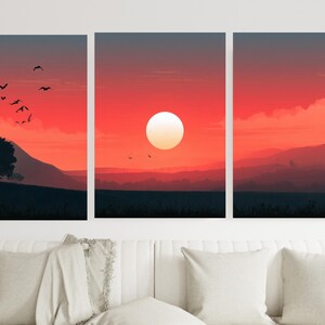 Könnte beinhalten: Ein dreiteiliges Wandbild-Set, das eine Sonnenuntergangslandschaft mit einer großen, blassgelben Sonne vor einem leuchtend roten und orangefarbenen Himmel zeigt. Die Szene enthält dunkle Silhouetten von Hügeln, Feldern und fliegenden Vögeln.