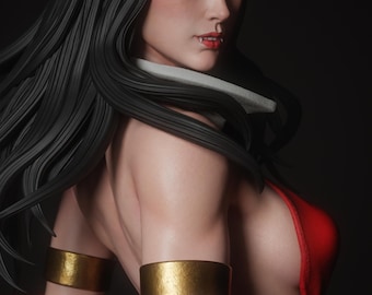 Puede incluir: Una figura coleccionable de un personaje con cabello negro largo, ojos verdes y colmillos visibles. La figura viste una prenda roja y brazaletes dorados en ambos brazos. El texto "nomnom Figures" es visible en la esquina superior derecha.