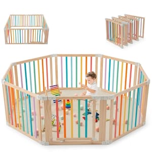 Peut inclure: Un parc octogonal en bois doté de barreaux verticaux peints dans une palette de couleurs arc-en-ciel, reliés par des joints en plastique gris clair. La structure est modulaire, permettant de la plier en un bloc compact pour le rangement.