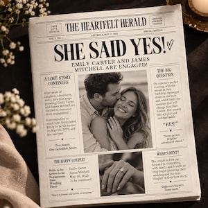May include: A newspaper titled The Heartfelt Herald featuring the headline She Said Yes! with a black and white photograph of an engaged couple, text detailing the engagement of Emily Carter and James Mitchell, and a close-up image of an engagement ring.