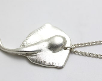 Raymond                       -solid silver ray necklace