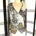 see more listings in the Blouses / Top / Sweaters section