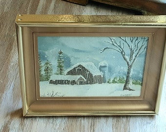 May include: A framed watercolor painting of a snowy winter scene with a farmhouse, trees, and a snow-covered field. The painting is signed "H. Price" in the lower right corner.