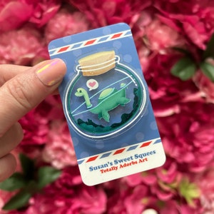 Nessie in a Bottle - Clear acrylic pin