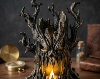 May include: A dark, weathered tree stump sculpture featuring a menacing face with sharp, jagged teeth and twisted branches. The hollow center contains a warm, glowing LED candle that illuminates the interior, casting light through the mouth.