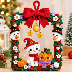 May include: A rectangular crochet wreath frame decorated with red berries, green leaves, white flowers, and acorns. It features two ghost figures in black hats, a central white cat in a red hat and scarf, and two orange pumpkins. A large red bow hangs at the top with a yellow moon and star charms.