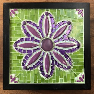 Mosaic mandala in purple on green