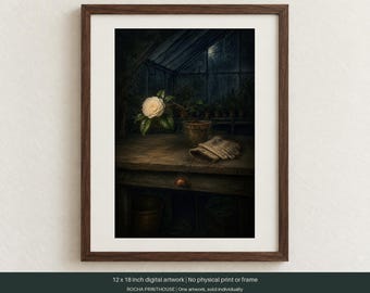 May include: A framed 12 x 18 inch digital artwork depicting a white camellia flower in a terracotta pot on a wooden workbench inside a dark greenhouse. A pair of beige gardening gloves rests on the table next to the plant, with a dark background.