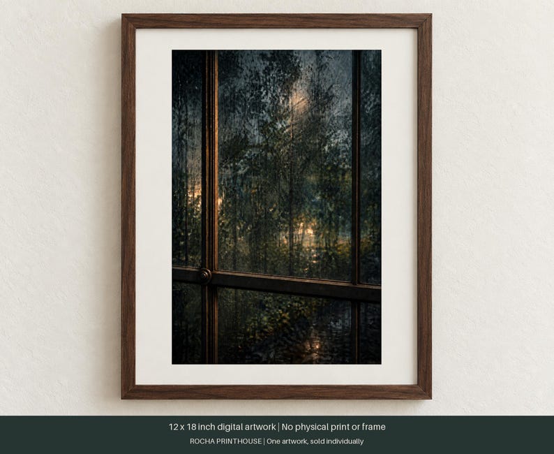 May include: A framed 12 x 18 inch digital artwork depicting a view through a window pane at night. The scene shows dark, rain-streaked glass looking out onto foliage illuminated by soft, warm light. The frame is dark brown wood with a white mat.