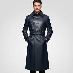 May include: A dark navy blue long-length coat featuring a structured collar, a series of three horizontal buckle straps across the upper chest, and a matching buckled belt at the waist. The coat has long sleeves and a smooth, solid finish.
