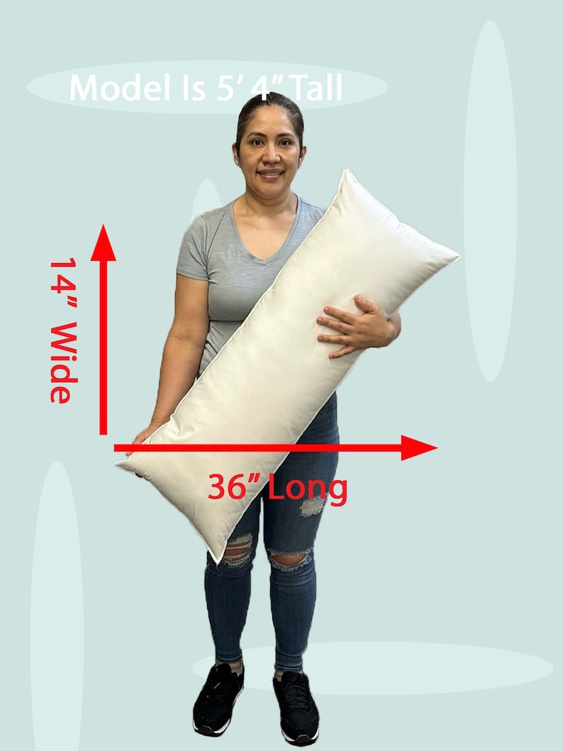 Lady holding an 14x36 pillow insert to demonstrate the size of the pillow form and how do I correctly measure my sham.  What size insert does an 13x35 lumbar sham need?  14 by 36 pillow inserts best fits a 14 by 34 decorative pillow sham.  What size pillow does my decorative sham need.  What size pillow insert does my 13 by 35 travel pillow cover need?