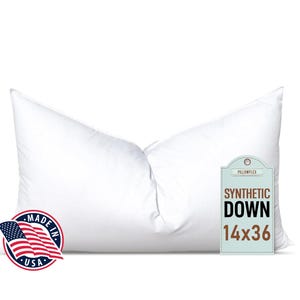 May include: A white, rectangular pillow with a tag that reads "Synthetic Down 14x36". The pillow is made in the USA, as indicated by a small American flag.