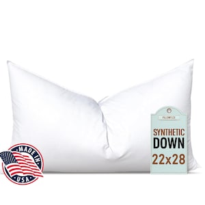May include: A white, rectangular pillow with a tag that reads "Synthetic Down 22x28". The pillow is made in the USA.