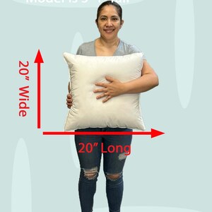 Lady holding a small 20x20 pillow insert to demonstrate the size of the pillow form and how do I correctly measure my sham.  What size insert does an 18x18 sham need?  20 by 20 pillow inserts best fits a 19 by 19 decorative pillow sham.  What size pillow does my decorative sham need.  What size pillow insert does my 18 by 18 pillow cover need?