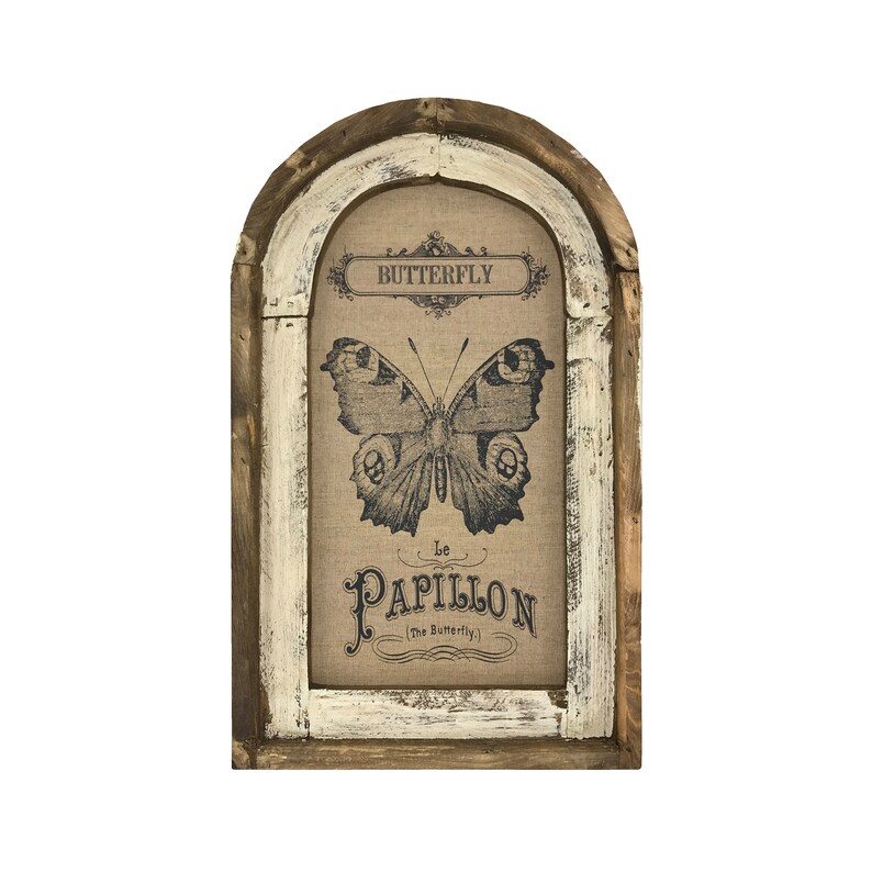 May include: A framed burlap print with a vintage butterfly illustration and the text "Butterfly Le Papillon (The Butterfly)". The frame is a distressed white and brown wood with an arched top.