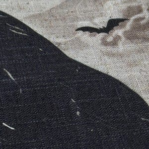 May include: A black crow silhouette on a beige burlap background with black bat silhouettes flying above.