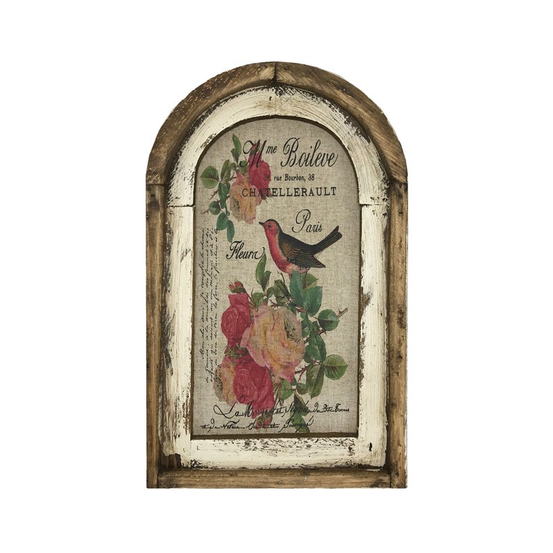 May include: A framed vintage-style print with a distressed white background and a brown wood frame. The print features a floral design with pink and white roses and a small red bird with a black beak and black eyes. The text on the print reads "Mme Boileve, rue Bourdon, 28, CHATELLERAULT, Paris, Fleurs".