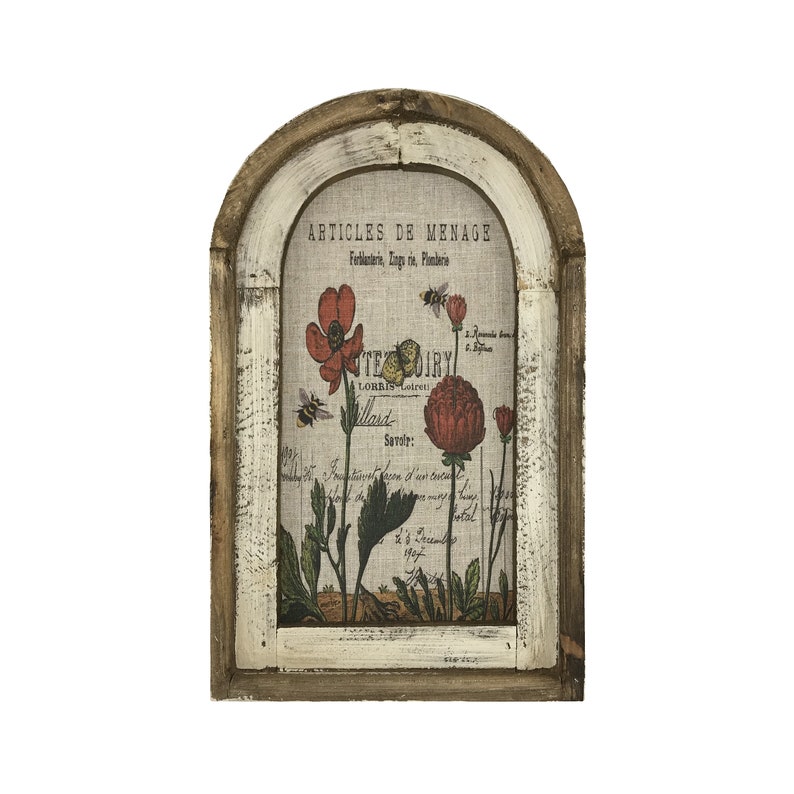 May include: A framed print with a white background and a floral design featuring red flowers and bees. The print has French text that reads "Articles de Menage Ferblanterie, Ling. rie, Plomberie" and "Teoiry Lorris Loiret llard Savoir: 1907".