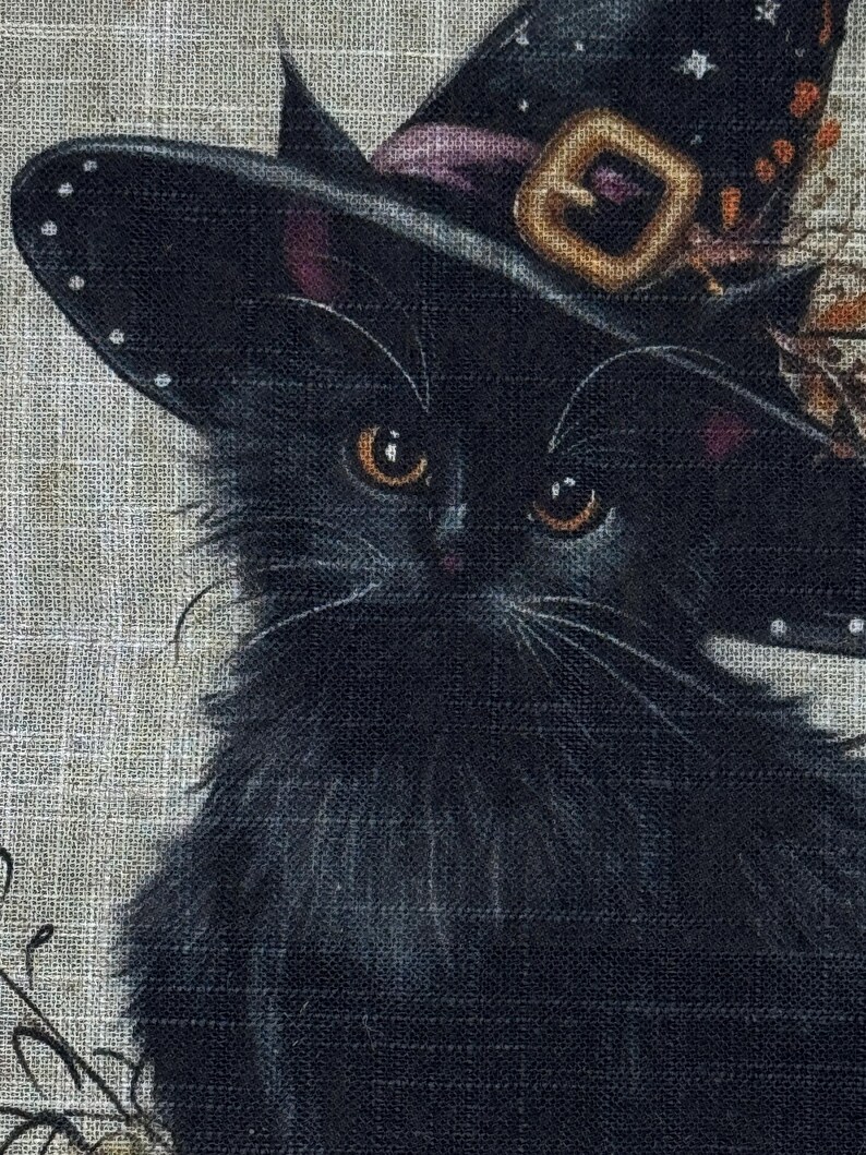 May include: A black cat wearing a witch's hat with a gold buckle and purple ribbon. The cat has orange eyes and long whiskers. The image is set against a textured, neutral background, evoking a Halloween theme.
