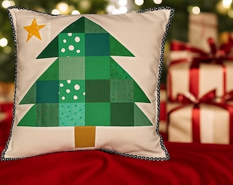 May include: Square decorative pillow with a Christmas tree design. The tree is made of various shades of green squares and triangles, with a yellow star at the top. The pillow has a cream-colored background and a black beaded border.