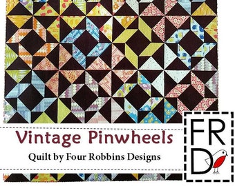 May include: A quilt pattern featuring a repeating design of colorful pinwheels on a dark brown background. The quilt is titled "Vintage Pinwheels" and is by Four Robbins Designs.