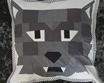 May include: Square decorative pillow featuring a geometric wolf face design in shades of gray, black, and white. The pillow has a white border with a dotted gray trim, creating a modern, artistic aesthetic.