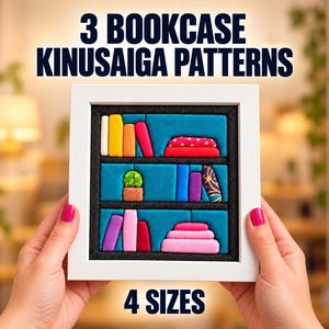 May include: A square white frame containing a Kinusaiga fabric art piece depicting a three-shelf bookcase filled with colorful books and a small potted plant. The text 3 BOOKCASE KINUSAIGA PATTERNS and 4 SIZES is printed in dark blue above and below the frame.
