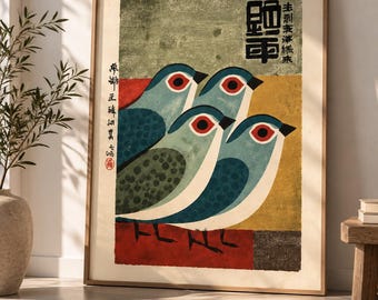 May include: A framed rectangular wall art print featuring four stylized blue birds with red eyes and spotted wings. The background consists of horizontal blocks of muted green, yellow, and red. Black Japanese calligraphy is printed on the artwork.