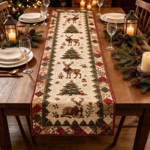May include: A quilted table runner featuring a repeating pattern of reindeer and Christmas trees on a cream background, bordered by a green and red geometric patchwork design. The runner is decorated with festive motifs including small gifts and bells.