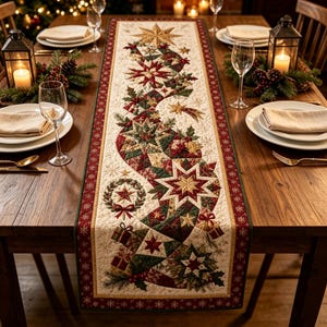 May include: A rectangular quilted table runner featuring a central winding pattern of red, green, and gold stars, holly leaves, and small gift boxes on a cream background, bordered by a dark red trim with a repeating white snowflake pattern.