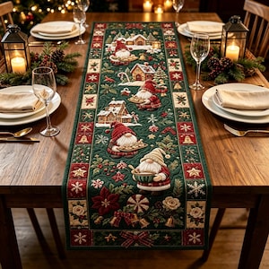 May include: A rectangular quilted table runner featuring a dark green background with a repeating pattern of gnomes, gingerbread houses, snowflakes, poinsettias, and bells. The design includes red and white accents, with a border of small squares.