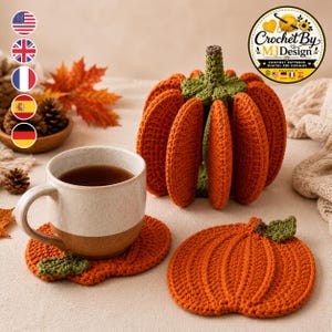 May include: A set of orange crochet pumpkin coasters and a three-dimensional pumpkin-shaped coaster holder. The coasters are flat and round with ribbed textures and a small green leaf detail. The holder features vertical orange panels and a green stem.