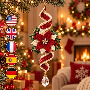 May include: A hanging Christmas ornament featuring a crocheted red and cream spiral ribbon, a central poinsettia flower with red and cream petals, green leaves, small red berries, and a clear faceted crystal teardrop pendant at the base.