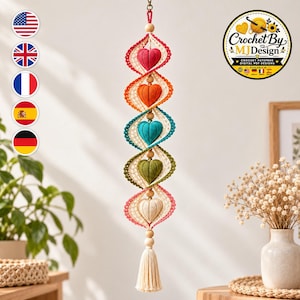 May include: A vertical hanging decoration featuring five crocheted hearts in red, orange, teal, olive green, and cream, each encased in a spiral of cream-colored lace. The hearts are separated by wooden beads, ending with a cream-colored tassel.