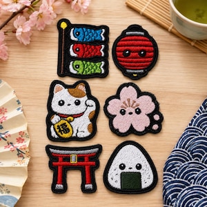 May include: Six embroidered patches featuring Japanese-inspired designs: a blue, red, and green carp streamer, a red lantern, a white and brown beckoning cat holding a gold coin with the character 福, a pink cherry blossom, a red torii gate, and an onigiri.