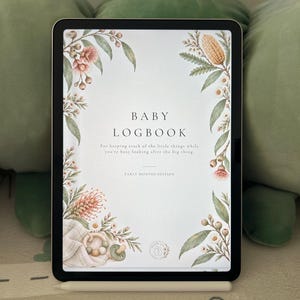May include: A digital tablet displaying a Baby Logbook cover with watercolour floral illustrations. The text reads: Baby Logbook, For keeping track of the little things while you're busy looking after the big thing, Early Months Edition.