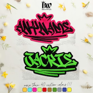 May include: Two embroidered patches featuring graffiti-style lettering and a crown icon. The top patch displays the text ANY NAME in black on a hot pink background. The bottom patch displays the text JACKIS in green on a black background.