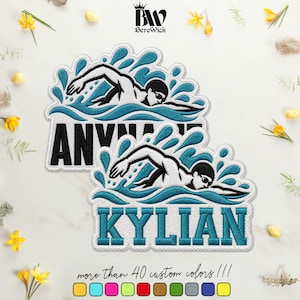 May include: Two embroidered patches featuring a swimmer in teal and white water splashes. The top patch displays the text ANYNAME in black, while the bottom patch features the name KYLIAN in teal. Both patches have a white border and stitching.