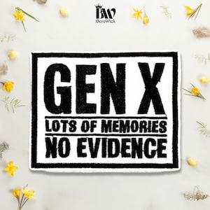 May include: A rectangular white patch with a thick black border featuring the black text GEN X, LOTS OF MEMORIES, and NO EVIDENCE. The design has a textured, embroidered appearance with a Berewick logo at the top center of the image.