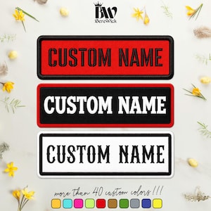 May include: Three rectangular embroidered patches with black borders. The top patch is red with black text reading CUSTOM NAME. The middle patch is black with white text reading CUSTOM NAME. The bottom patch is white with black text reading CUSTOM NAME.
