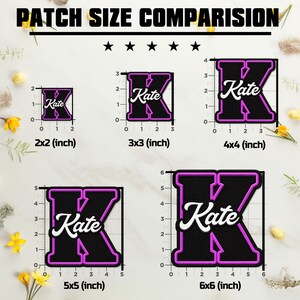 May include: A size comparison chart for black and pink embroidered letter K patches with the name Kate in white script. The chart displays five patches with dimensions labelled in inches: 2x2, 3x3, 4x4, 5x5, and 6x6 inches, each with a ruler guide.