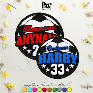 May include: Two circular embroidered patches featuring a soccer ball design. The larger patch displays the text Teamname, ANYNAME, and the number 2. The smaller patch features the text Owlteam, HARRY, and the number 33 with white stars.