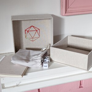 Beige Dice Box with Holographic D20 Print, Notebook, Set of 7 Dice and Drawstring Bag