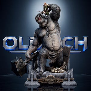 May include: A detailed collectible statue featuring a large, grey, muscular troll holding a spiked mace, with a smaller elf figure standing on its shoulder. The base includes a pile of skulls and a plaque reading Lord of the Rings.