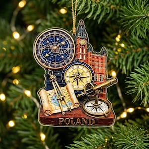 May include: A flat, decorative ornament featuring a detailed illustration of a brick building, a large blue celestial map, a golden compass, a telescope, and a rolled map. The word POLAND is printed in gold letters at the bottom of the base.