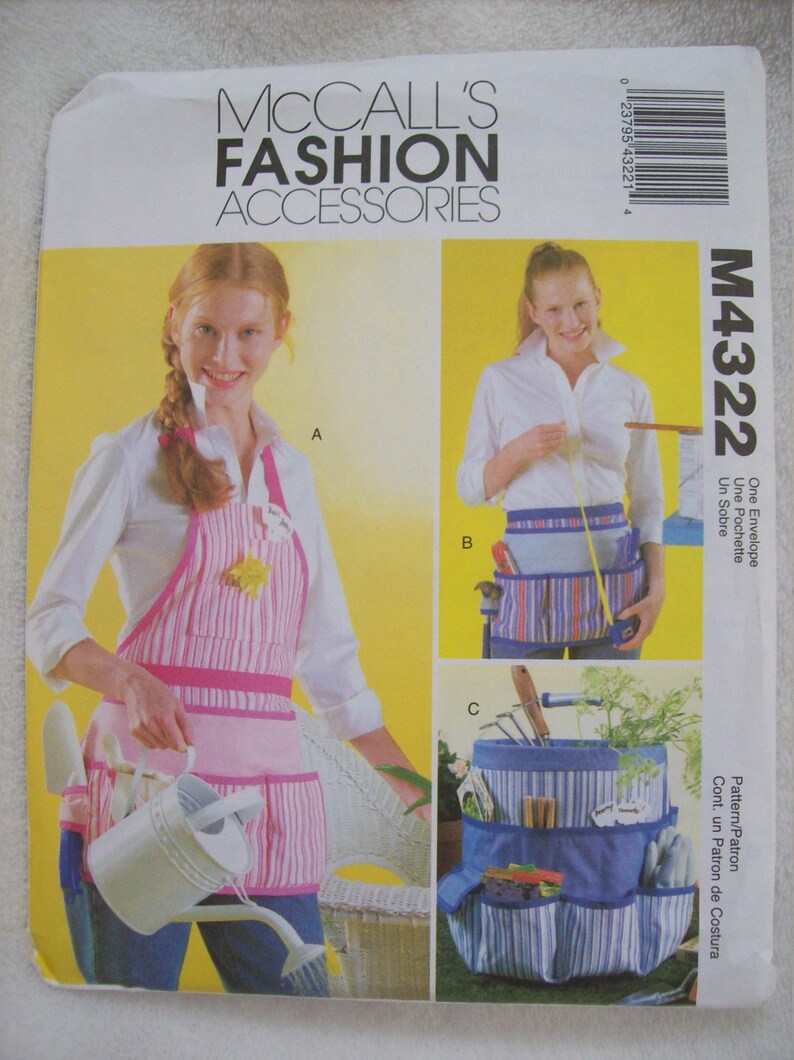 May include: A sewing pattern for a gardening apron, a gardening belt, and a gardening tote. The pattern is called McCall's Fashion Accessories M4322. The apron is pink and white striped with pockets. The belt is blue and white striped with pockets. The tote is blue and white striped with multiple pockets.