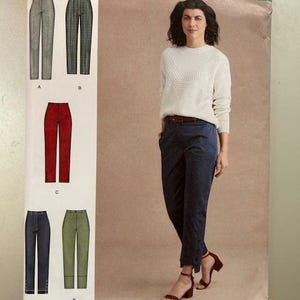 May include: Simplicity sewing pattern number 8957, size US 6-14, Euro 32-40, French 34-42. The pattern includes instructions for making pants with different styles, including a pair of red pants, a pair of green pants, and a pair of blue pants.