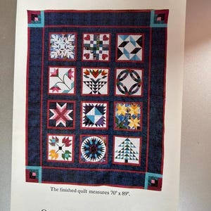 May include: A quilt pattern sheet titled SEASONS by Osage County Quilt Factory. The design features twelve distinct square blocks with various geometric and seasonal motifs, framed by a dark blue border. The finished quilt measures 70" x 89".