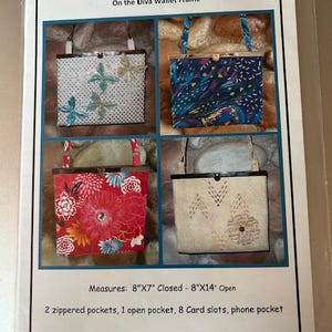 May include: A product sheet for the "Glam Shell" wallet frame, featuring four different wallet designs. The wallets are shown in a variety of colors and patterns, including floral and butterfly motifs. The wallets measure 8"x7" closed and 8"x14" open.